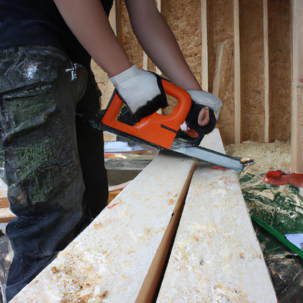 Person sawing wood for construction